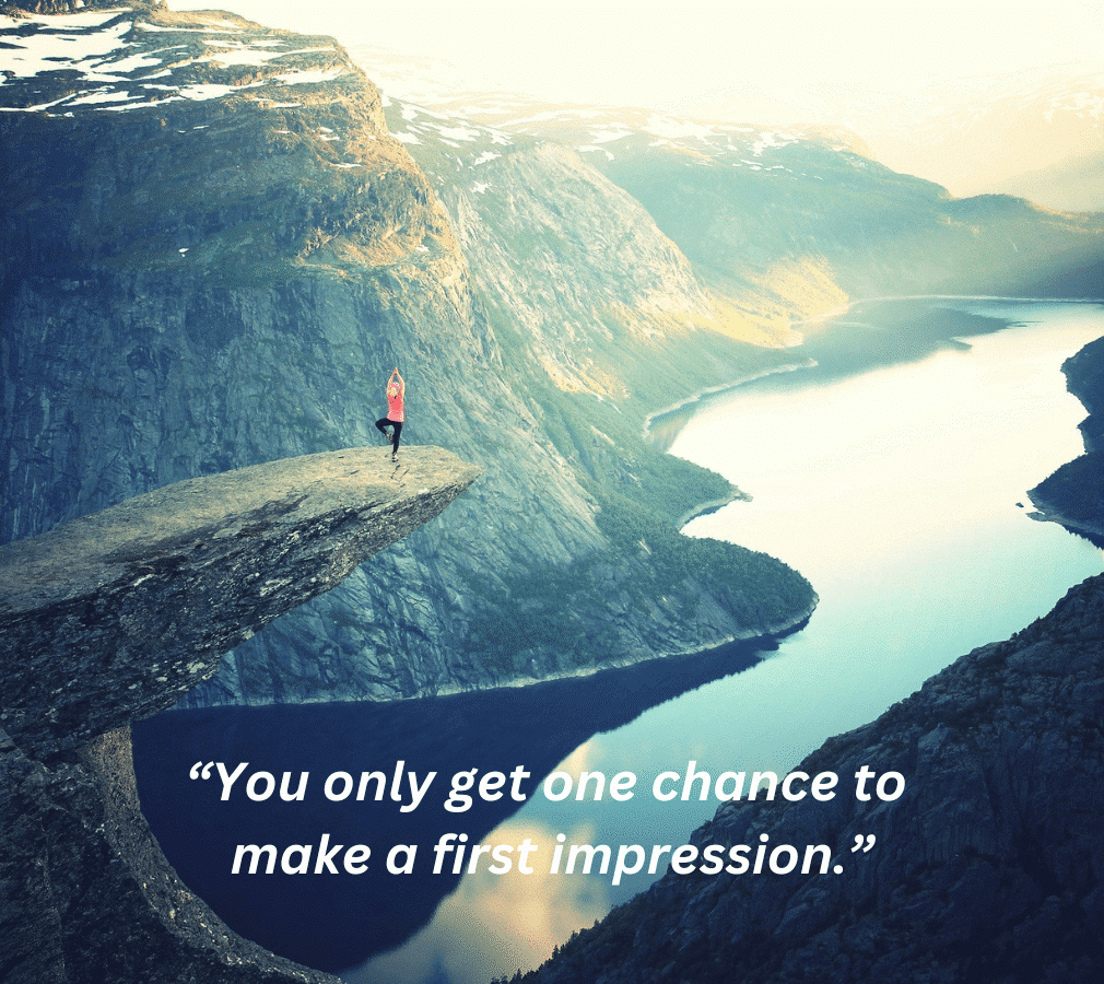 Woman in pink doing yoga on the precipice of a cliff overlooking a forest landscape.