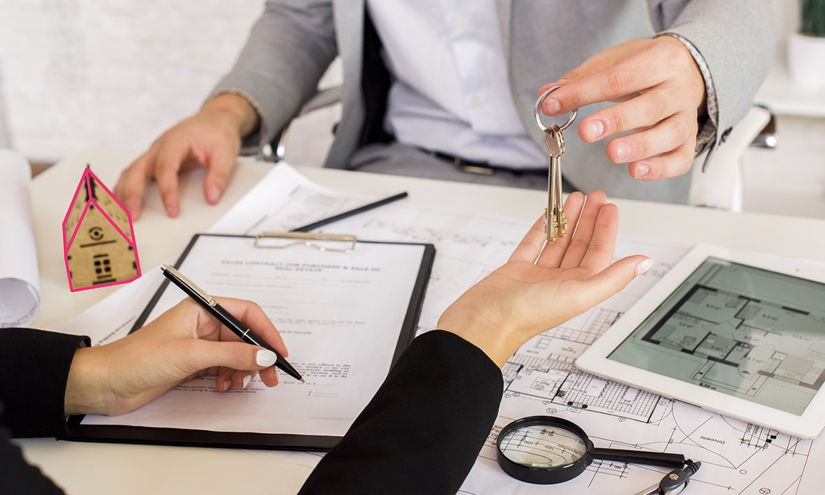 man handling over a key