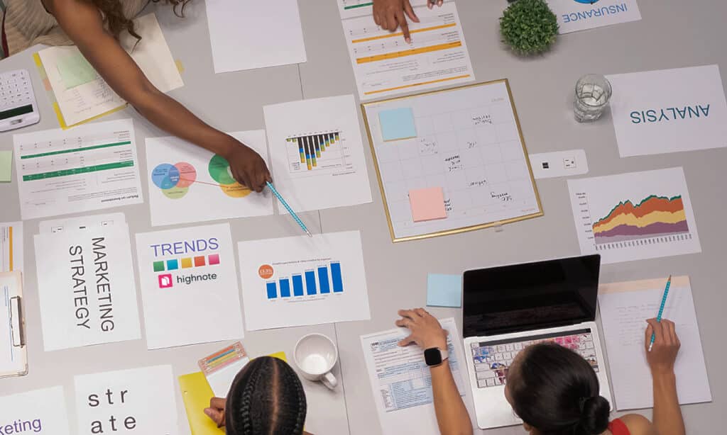 How to Make a Listing Presentation Visually Appealing 11 people discussing over graphs